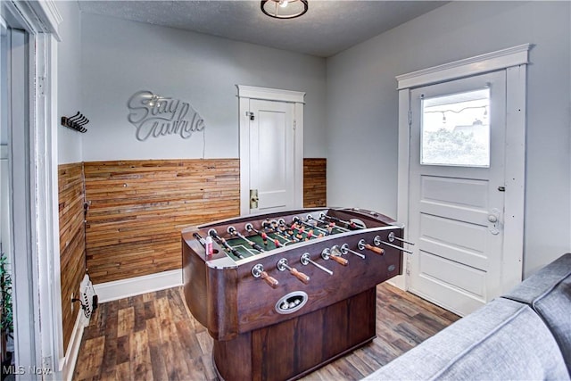 1289 W 115th St, Cleveland, OH 44102 - playroom featuring dark wood-type flooring and a textured ceiling