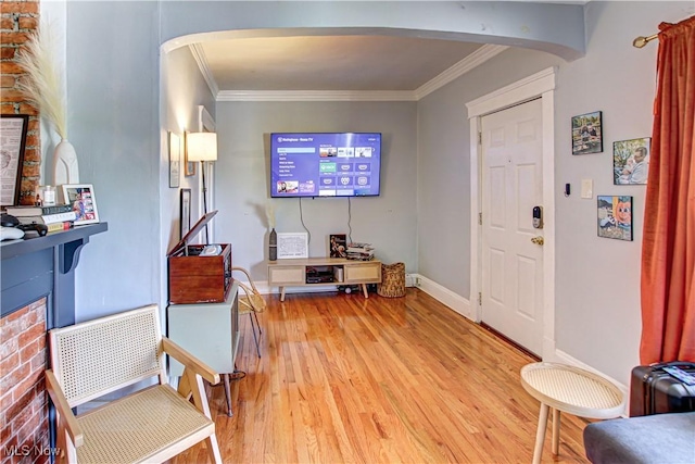 1289 W 115th St, Cleveland, OH 44102 - living room featuring arched walkways, light wood finished floors, and ornamental molding