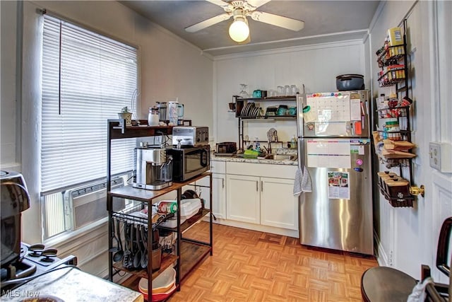1289 W 115th St, Cleveland, OH 44102 - kitchen featuring stainless steel appliances, white cabinets, crown molding, ceiling fan, and open shelves