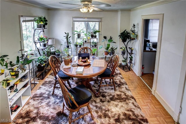1289 W 115th St, Cleveland, OH 44102 - dining space featuring ceiling fan and crown molding