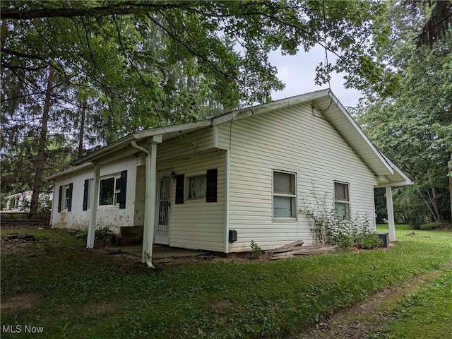 4562 Erie Ave NW, Canal Fulton, OH 44614 - view of property exterior featuring a lawn
