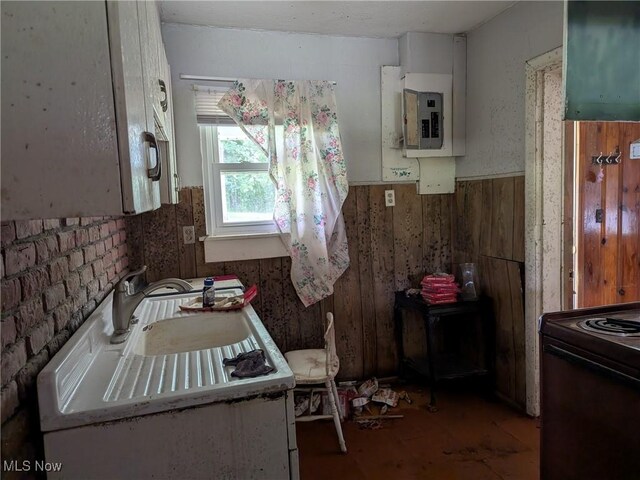 4562 Erie Ave NW, Canal Fulton, OH 44614 - kitchen with black / electric stove, wainscoting, and electric panel