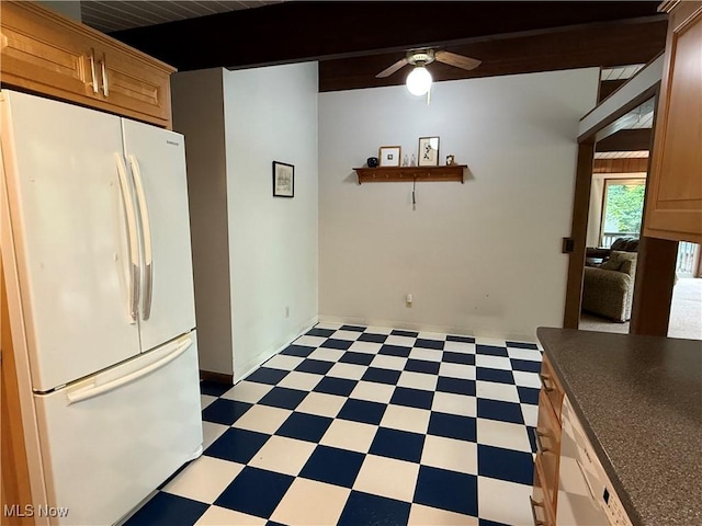 126 Stony Creek Dr, Millersburg, OH 44654 - kitchen with freestanding refrigerator, light floors, a ceiling fan, dark countertops, and beamed ceiling