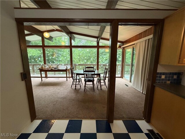 126 Stony Creek Dr, Millersburg, OH 44654 - dining room with light floors, plenty of natural light, lofted ceiling, and light colored carpet