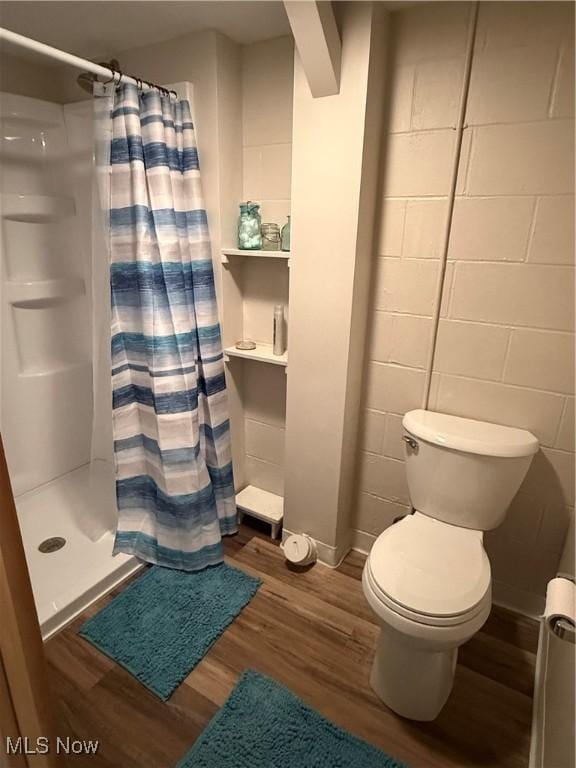 126 Stony Creek Dr, Millersburg, OH 44654 - full bathroom featuring wood finished floors and a shower stall
