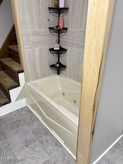 202 N Ray St, Baltic, OH 43804 - bathroom with tile patterned flooring and a combined bath / shower with jetted tub