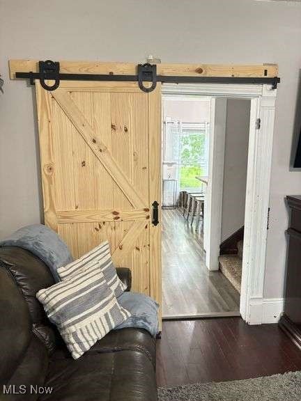 202 N Ray St, Baltic, OH 43804 - sitting room with wood finished floors and a barn door
