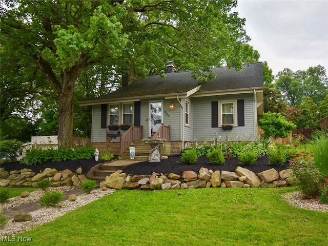 220 N Cleveland Ave, Niles, OH 44446 - view of front of property with a front yard and a chimney