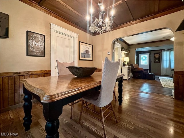 220 N Cleveland Ave, Niles, OH 44446 - dining room with arched walkways, ornamental molding, wood finished floors, a wainscoted wall, and a chandelier