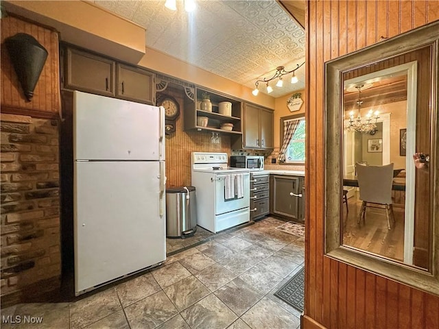 220 N Cleveland Ave, Niles, OH 44446 - kitchen with white appliances, wooden walls, a chandelier, open shelves, and an ornate ceiling