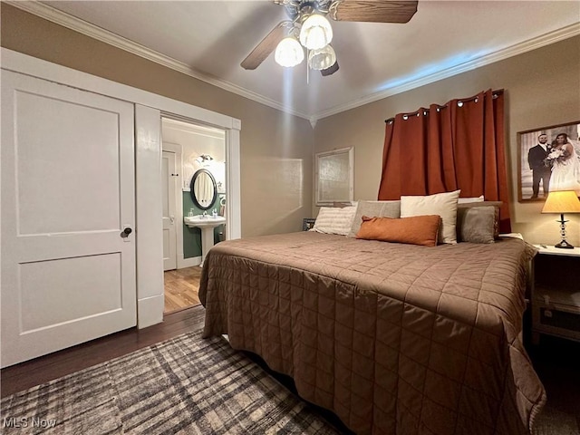 220 N Cleveland Ave, Niles, OH 44446 - bedroom with dark wood-style floors, ornamental molding, connected bathroom, and a ceiling fan