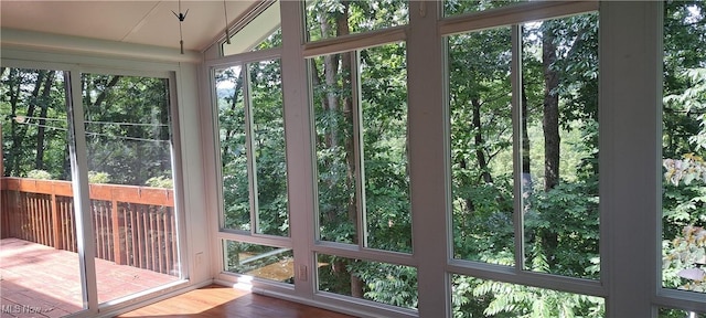 109 Hillview Dr, Charleston, WV 25314 - unfurnished sunroom with wood finished floors, lofted ceiling, and a deck