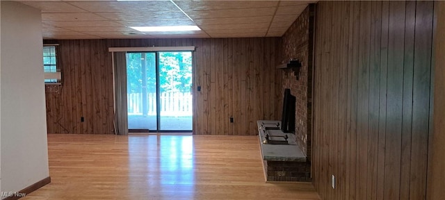 109 Hillview Dr, Charleston, WV 25314 - unfurnished living room with wood walls and wood finished floors