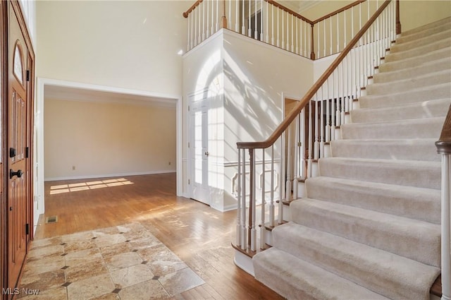 3773 N Shore Dr, Akron, OH 44333 - entryway with a high ceiling, stairs, and wood finished floors