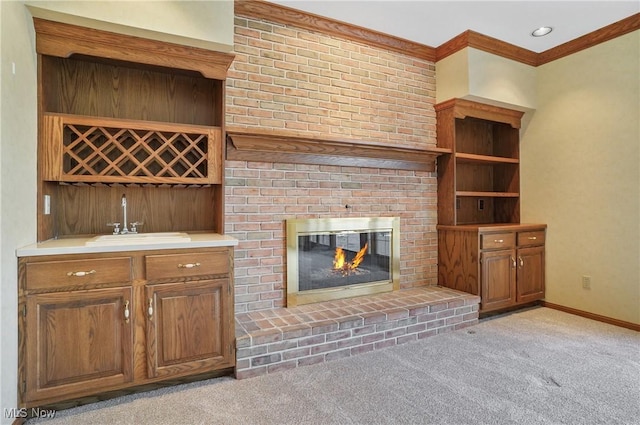 3773 N Shore Dr, Akron, OH 44333 - unfurnished living room featuring bar area, light colored carpet, a fireplace, and crown molding