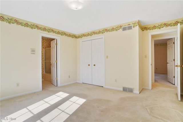 3773 N Shore Dr, Akron, OH 44333 - unfurnished bedroom with light carpet, a closet, and connected bathroom