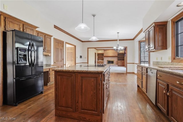 3773 N Shore Dr, Akron, OH 44333 - kitchen featuring black appliances, dark wood finished floors, a center island, decorative light fixtures, and a chandelier