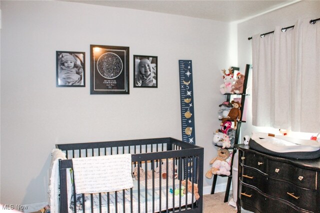 6221 Gault Rd, Canfield, OH 44406 - bedroom featuring a crib and carpet flooring