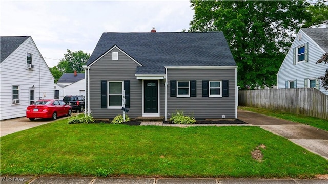 2405 Harding Rd, Cuyahoga Falls, OH 44223 - view of front of property featuring a shingled roof, a chimney, and cooling unit