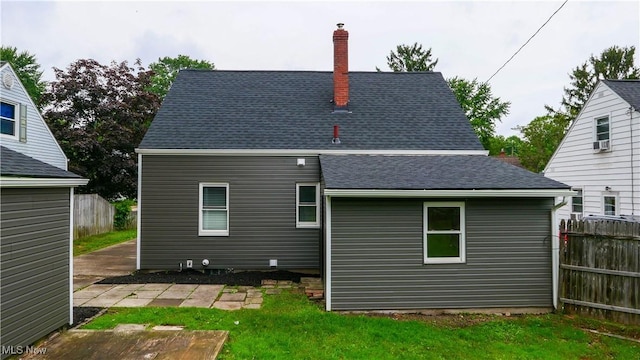 2405 Harding Rd, Cuyahoga Falls, OH 44223 - rear view of house featuring a chimney and a shingled roof