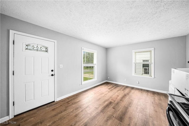 2405 Harding Rd, Cuyahoga Falls, OH 44223 - foyer featuring wood finished floors, healthy amount of natural light, and a textured ceiling