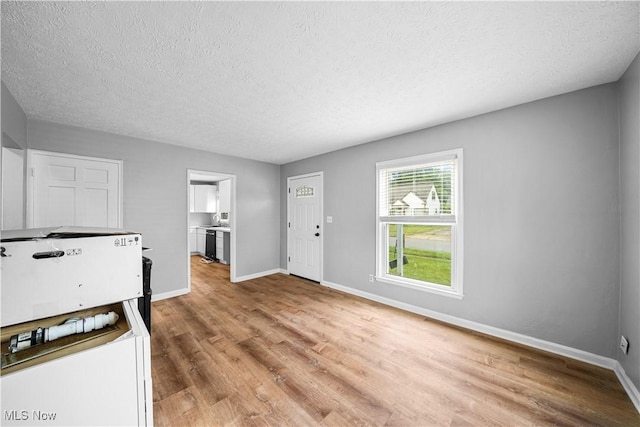 2405 Harding Rd, Cuyahoga Falls, OH 44223 - entryway featuring light wood-type flooring and a textured ceiling