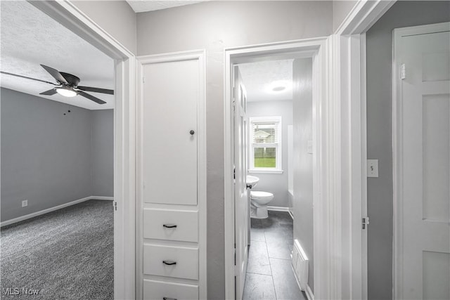2405 Harding Rd, Cuyahoga Falls, OH 44223 - hallway featuring a textured ceiling and tile patterned flooring