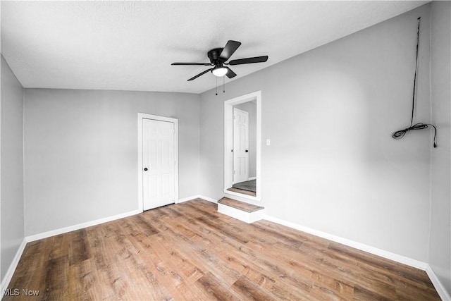 2405 Harding Rd, Cuyahoga Falls, OH 44223 - unfurnished bedroom featuring wood finished floors and a ceiling fan