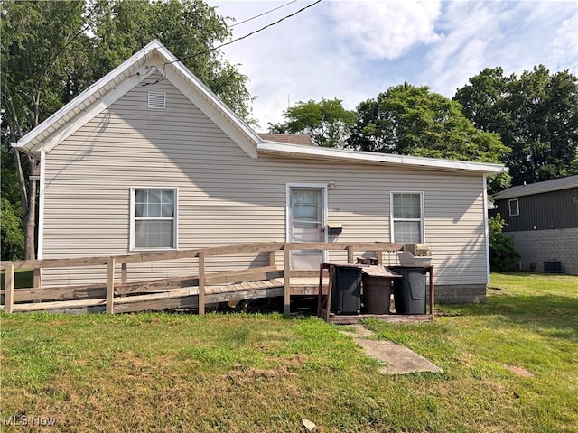 1209 Camden Ave, Parkersburg, WV 26101 - rear view of house with a yard and a wooden deck