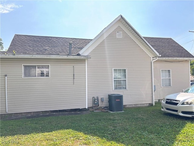 1209 Camden Ave, Parkersburg, WV 26101 - view of home's exterior featuring a yard and roof with shingles