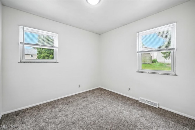 16-18 E Linwood Ave, Akron, OH 44301 - empty room with carpet floors and healthy amount of natural light