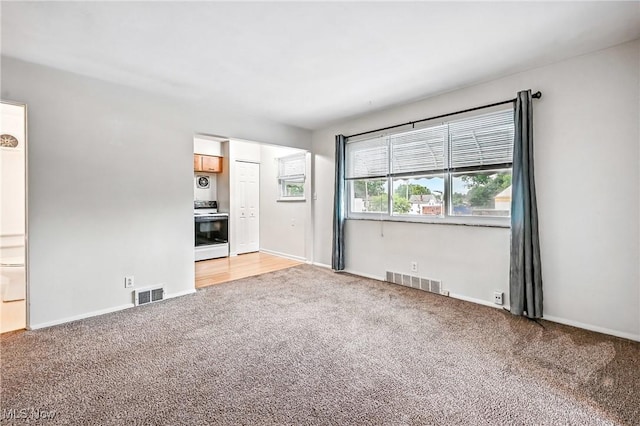 16-18 E Linwood Ave, Akron, OH 44301 - unfurnished living room with light colored carpet and baseboards