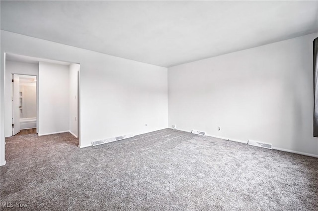 16-18 E Linwood Ave, Akron, OH 44301 - carpeted empty room with baseboards