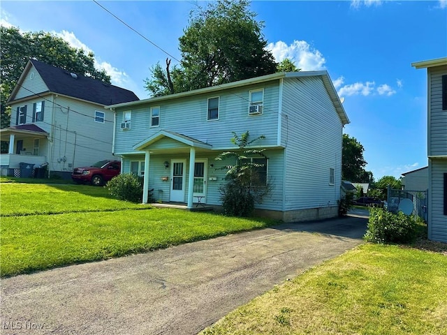 467 Elm St, Struthers, OH 44471 - view of front facade with a front yard, covered porch, and cooling unit