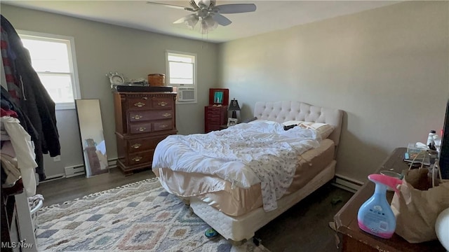 467 Elm St, Struthers, OH 44471 - bedroom featuring baseboard heating, wood finished floors, cooling unit, and ceiling fan