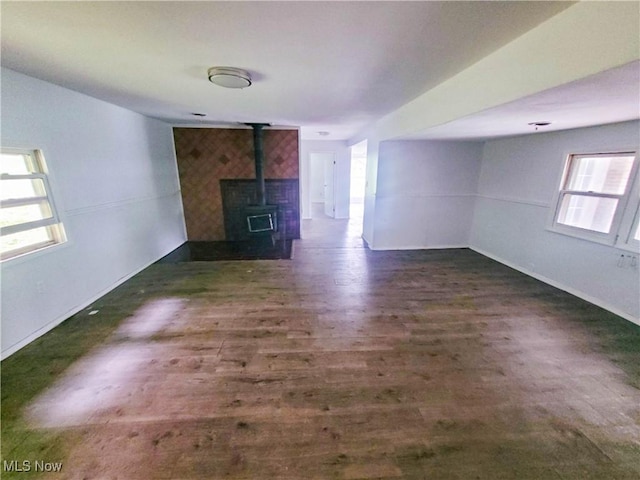 56612 Mcgee Rd, Shadyside, OH 43947 - spare room featuring a wood stove and wood finished floors