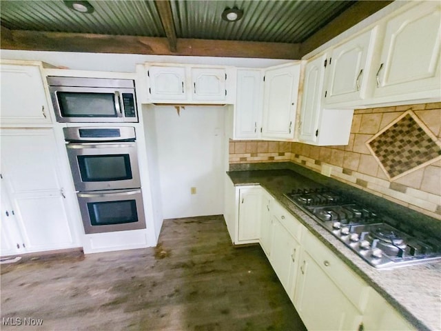 56612 Mcgee Rd, Shadyside, OH 43947 - kitchen featuring stainless steel appliances, a wooden ceiling with exposed beams, backsplash, and white cabinetry