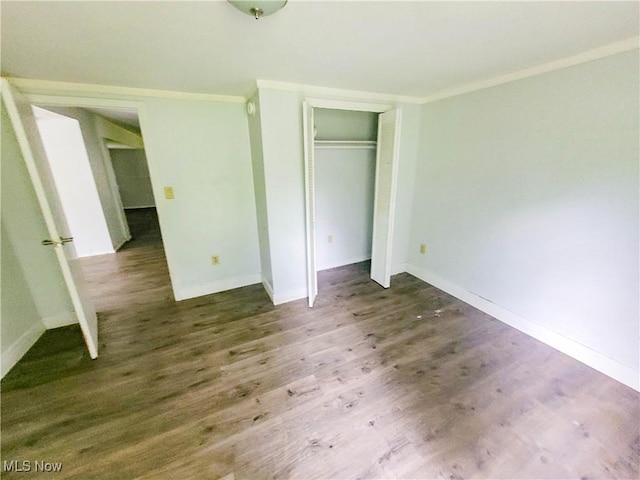56612 Mcgee Rd, Shadyside, OH 43947 - unfurnished bedroom with crown molding, wood finished floors, and a closet