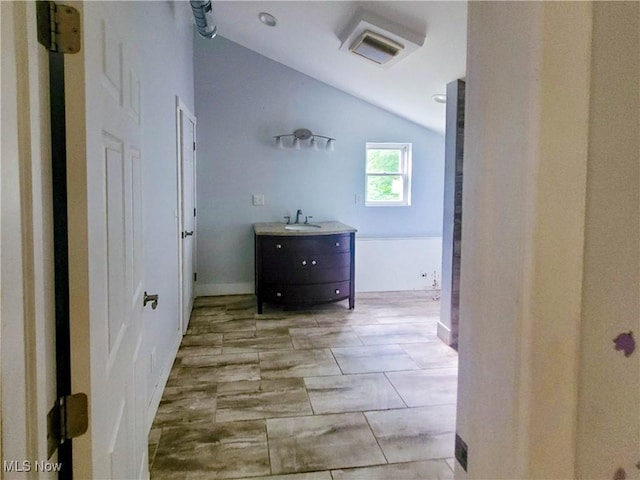 56612 Mcgee Rd, Shadyside, OH 43947 - bathroom with lofted ceiling and vanity