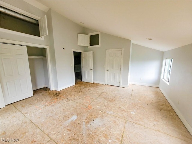 56612 Mcgee Rd, Shadyside, OH 43947 - unfurnished bedroom with vaulted ceiling and a closet
