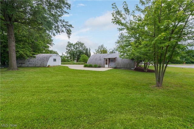 4465 Oberlin Ave, Lorain, OH 44053 - view of green lawn featuring an outbuilding