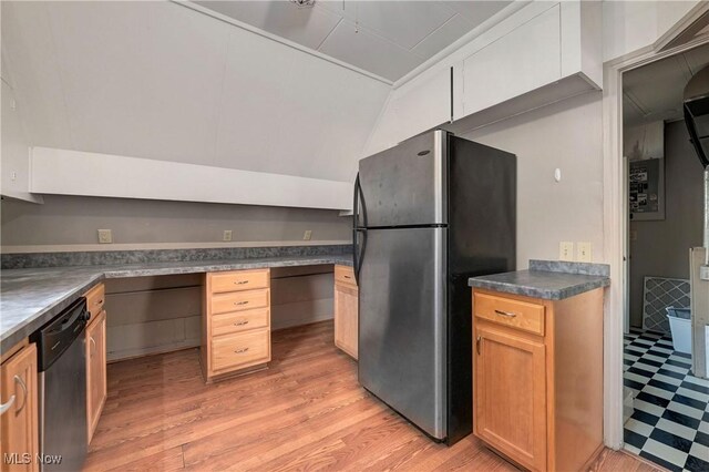 4465 Oberlin Ave, Lorain, OH 44053 - kitchen with appliances with stainless steel finishes, built in desk, light flooring, vaulted ceiling, and dark countertops