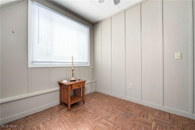 4465 Oberlin Ave, Lorain, OH 44053 - spare room featuring a decorative wall and ceiling fan