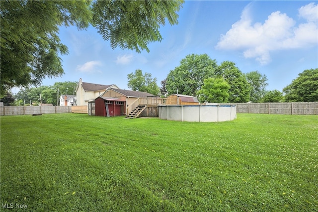 77 W Park Ave, Hubbard, OH 44425 - fenced backyard featuring an outdoor pool, stairway, and a wooden deck