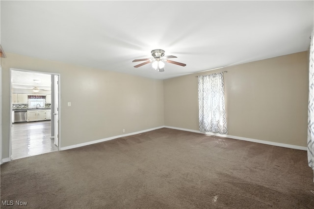 77 W Park Ave, Hubbard, OH 44425 - empty room featuring a ceiling fan and carpet