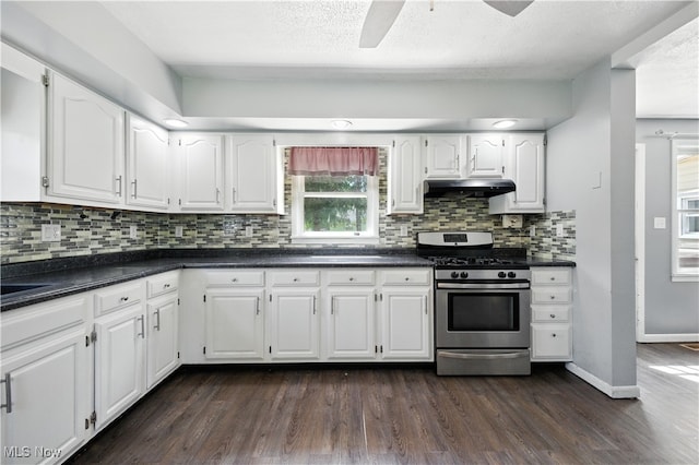 77 W Park Ave, Hubbard, OH 44425 - kitchen with stainless steel range with gas stovetop, under cabinet range hood, dark countertops, dark wood-type flooring, and white cabinets