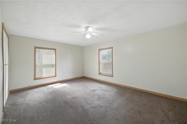 77 W Park Ave, Hubbard, OH 44425 - carpeted spare room featuring a ceiling fan and baseboards