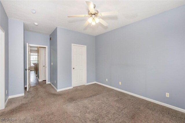 101 Stonegate Cir, Seven Hills, OH 44131 - unfurnished bedroom with carpet floors and a ceiling fan