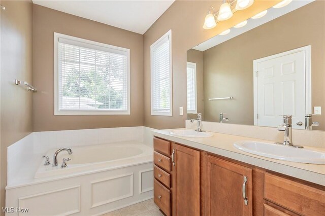 101 Stonegate Cir, Seven Hills, OH 44131 - full bathroom with double vanity, a garden tub, and tile patterned flooring