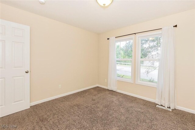 101 Stonegate Cir, Seven Hills, OH 44131 - carpeted empty room with baseboards